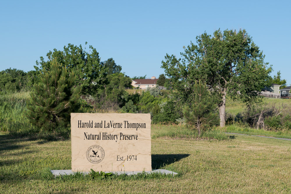 Entrance sign and trees at the Thompson Preserve