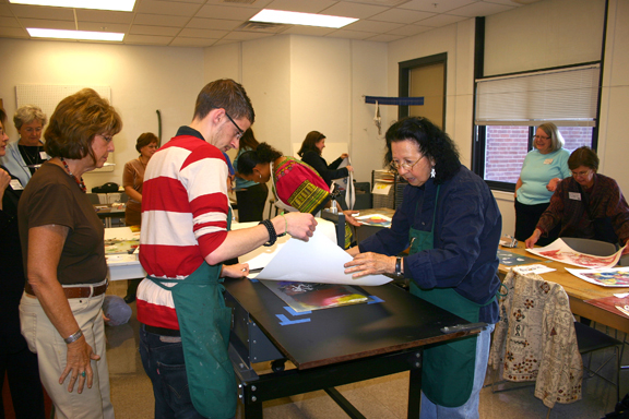Students and instructors work on printmaking projects at Memorial Hall