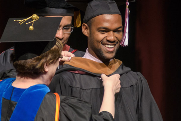 Student being awarded at graduation ceremony
