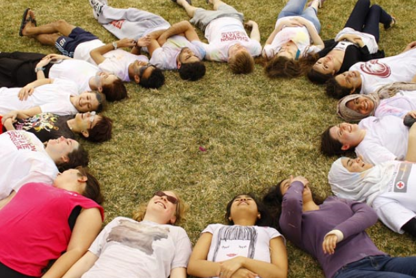 Students from the international program connecting in a circle