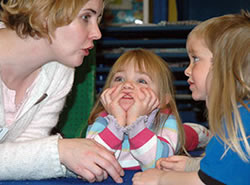 A teacher works with children