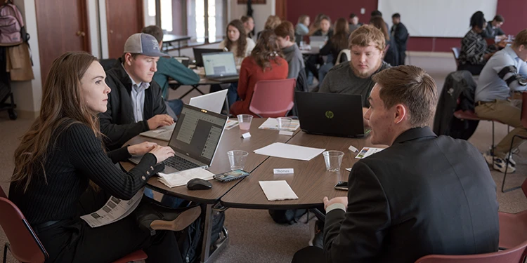 A group of business students sitting at a table