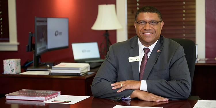 An image of the college's president