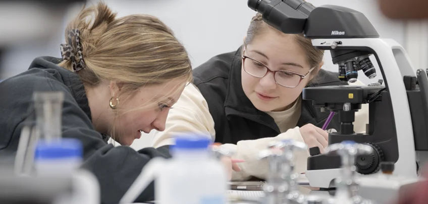 Two students working in a science lab
