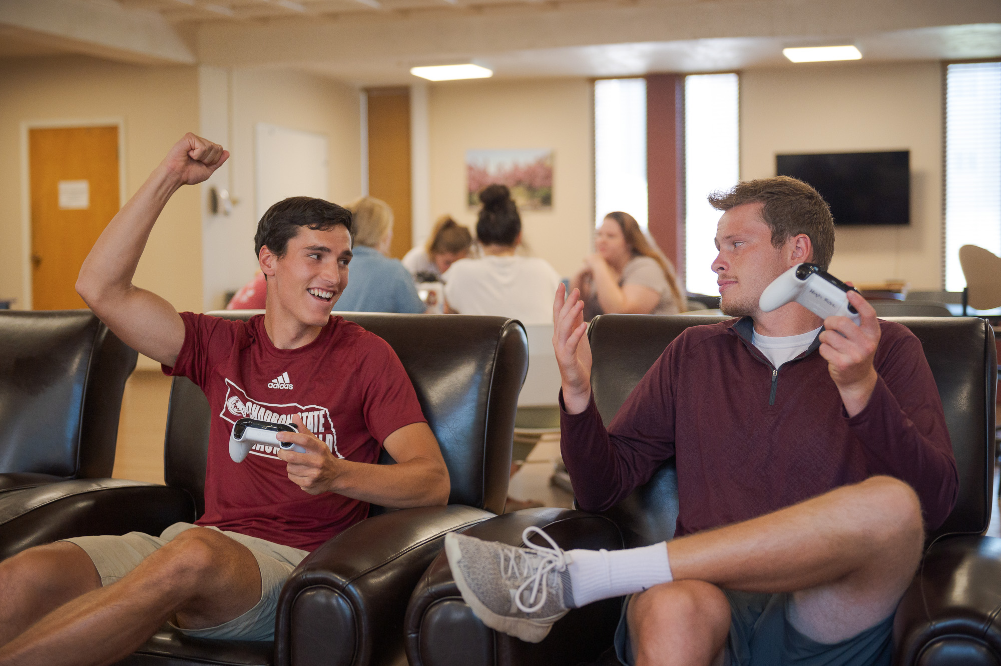 Students cheering in the Hub