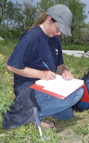Amanda Dopheide records data near Toadstool Park in this summer 2003 photo.