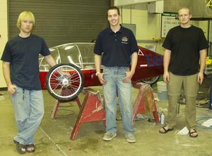 Chadron State Society of Manufacturing Engineers members Kory Westers, Jason Winter and Guy Gutsche with CSC's electric car.