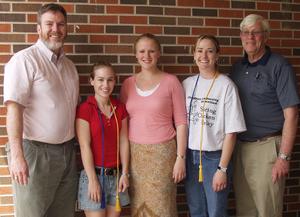 Chadron State students Ashley Pullen and Lariann Smith are shown with the ropes they were awarded with membership. The group is flanked by advisors Thomas Swanke and Ron Burke, at right. Zeta Chapter member Hannah McMaster is at center.
