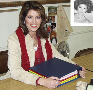 Julie Thompson O'Connell sits at a desk