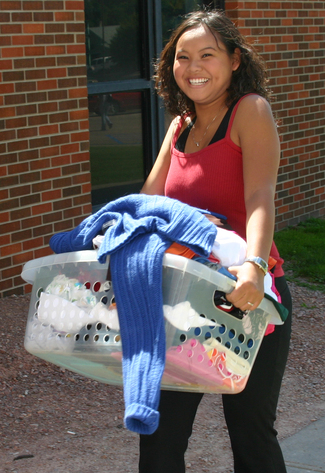 Dolly Sayaloune moves some of her belongings into Kent Hall on Thursday.