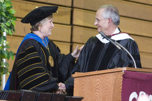 Dr. John Harms is congratulated by Chadron State President Dr. Janie Park while receiving the Honorary Doctor of Humane Letters degree.
