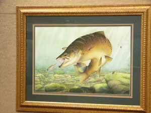 This painting of a brown trout about to have a snack is among the art work by Chadron State graduate Zach Even that is on display in the Sandoz Center.