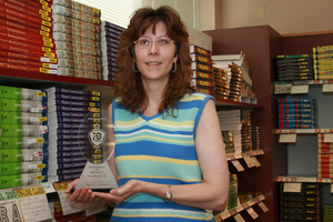 Kay Hill holding an award