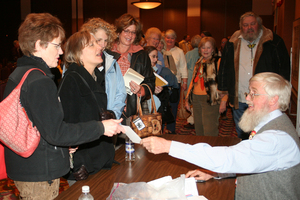 People exchange conversation with Roger Swain