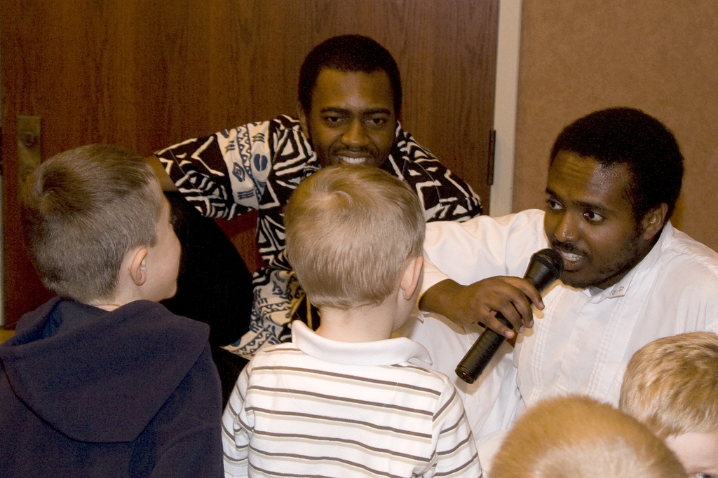 Chadron State College students Alula Mazengia and Sam Tetteh tell children a traditional Ethiopian story.