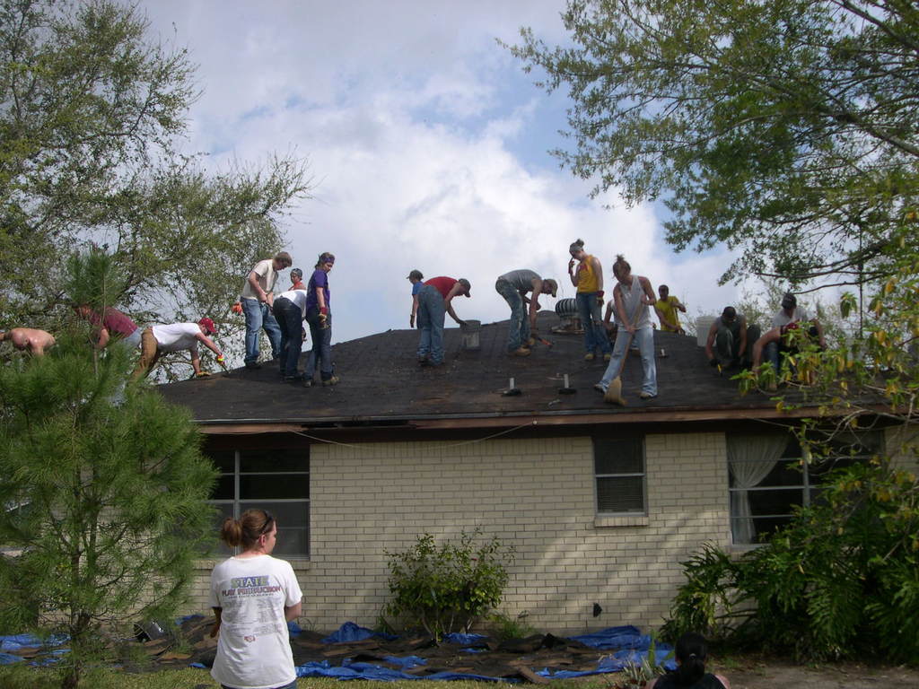 Chadron State College students work on a hurricane-damaged roof in Galveston, Texas.