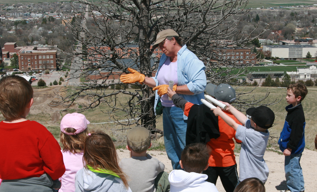 Chadron State College horticulturist Lucinda Mays talks to kindergarteners atop C Hill.