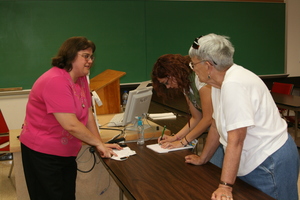 Dr. Ann Buchmann greets audience members