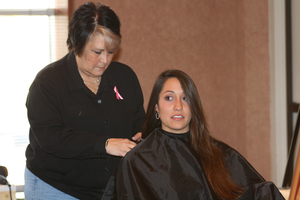 Tagen Bierly gets her hair cut by Linda Novotny
