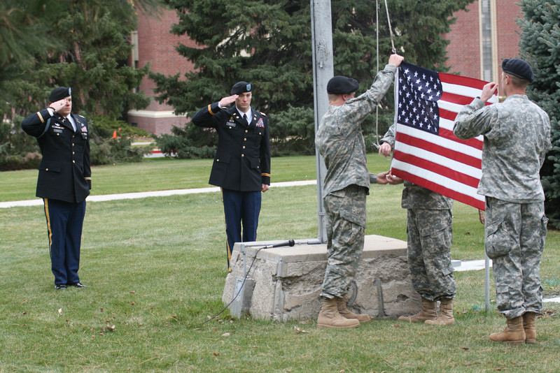 Maj. Logan Veath and Capt. Raymond Phillips salute the flag during this scene from the 2010 Chadron State College Veterans Day ceremony.