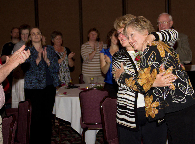 Janie Park, at right, and Lois Veath, retiring vice president for academic affairs, receive applause during a surprise going away party thrown in their honor May 4. (Photo by Justin Haag)