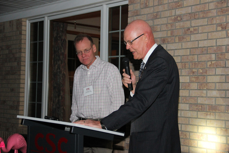 Gary Bieganski, at right, presents the Nebraska State College System Teaching Excellence Award to Mike Leite, at right. (Photo by Justin Haag)