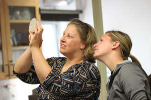 Wendy Jamison and Jocelyn look at an agar plate