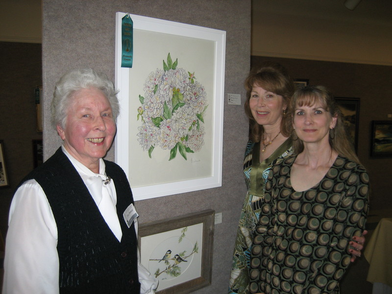 Myra Omelanuk and her daughters Kathy Bahr and Joy Omelanuk pose at the annual juried art show at the Alliance Carnegie Arts Center in 2008. The painting of white peonies, pictured, won an award at that time and is currently on exhibit in the Memorial Hall Gallery 239.