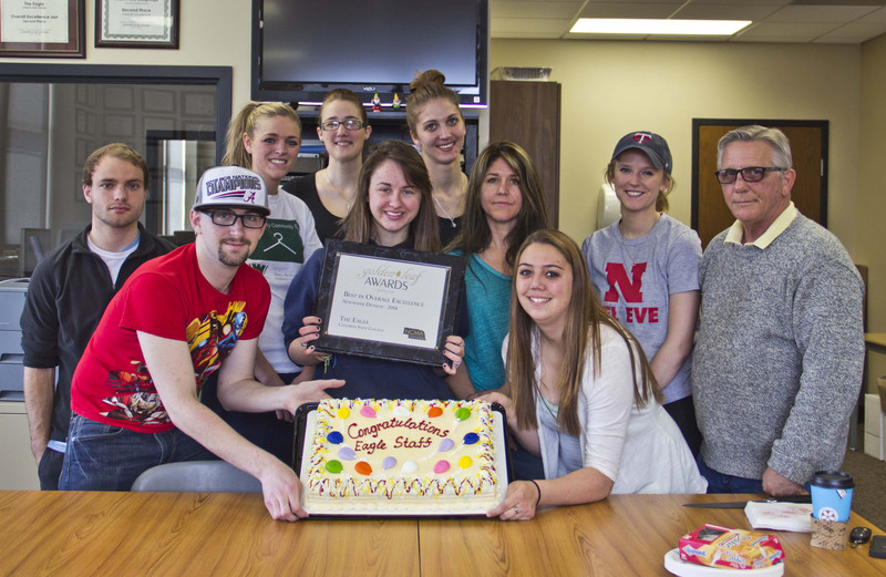 Staff members of the Chadron State College Eagle newspaper pose to celebrate the fourth consecutive year the Eagle has placed first in