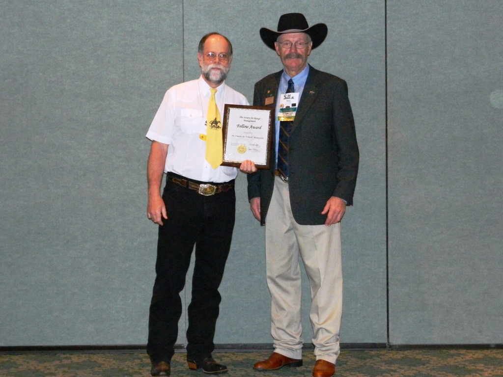 Dr. Chuck Butterfield, recipient of the Fellow Award, at the February meeting of the Society for Range Management in Orlando, Fla. with SRM president Wally Butler.
