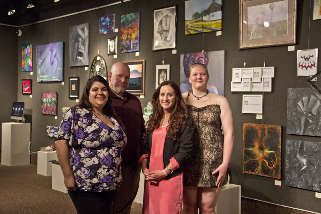 From left, Julya Briseno of Kenosha, Wisc., Rob Heckman of Crawford, Neb., Christina Ferrero of Bayard, Neb., and Macee Kellner of Bucklin, Kan., pose with their Senior Thesis Student Art Show