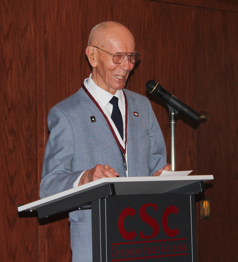 Ed Bieganski smiles during his speech accepting the Distinguished Alumni Award