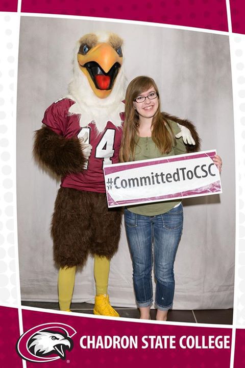 Keziah Johnson of Dickinson poses with the Chadron State College mascot, Elmo