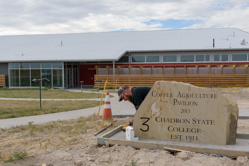 Steve Weber removes the form around the base of the new stone marker