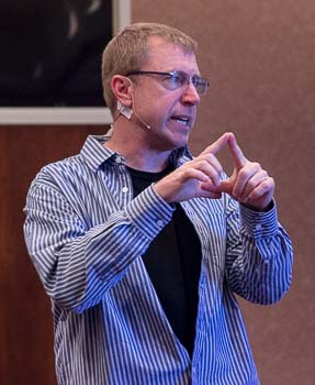 Paul Wesselmann speaks at a conference.