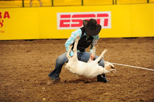 Shelby Wichell competing in goat tying