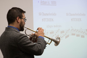 Sid Shuler plays a trumpet