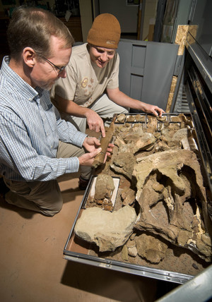 Mike Leite and a student examine samples