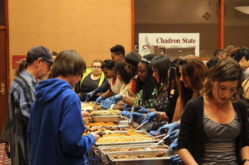 Chadron State College students, faculty, staff, alumni and Chadron community members gather for the International Food Tasting Party in the Student Center Ballroom, March 19, 2016.