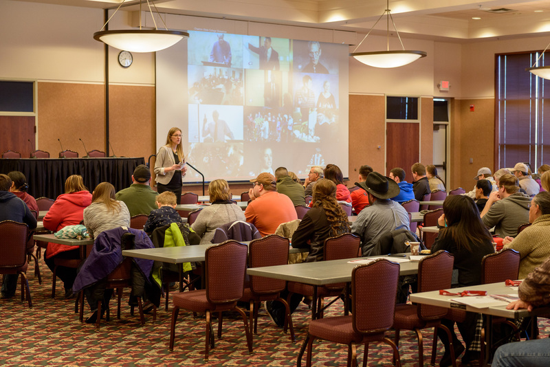 Admissions staff member Erin Heide speaks to parents of incoming students during Transfer Day on February 16, 2015.