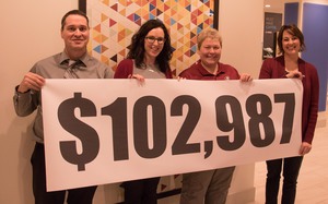 Leaders of the Chadron State Foundation fall fund drive, from left, Jason Carnahan and Jennifer Brown, community co-leads, and Dr. Dawn Brammer and Colette Fernandez, campus co-leads, pose with a poster of the amount raised in the annual campaign Tuesday, Nov. 28, 2017, at the Holiday Inn Express.