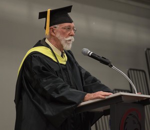 Dr. James ORourke, Distinguished Service Award recipient, Chadron State College graduation speaker, and Professor Emeritus of Agriculture, speaks to undergraduates in the Chicoine Center Friday, Dec. 15, 2017.