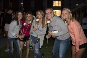 Students pose during Homecoming bonfire