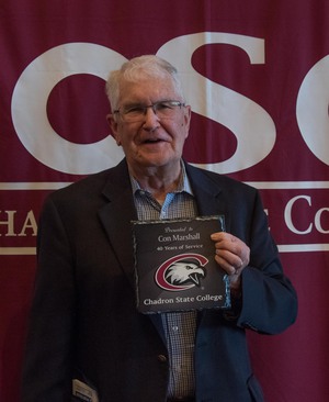 Con Marshall poses for photo after winning awards