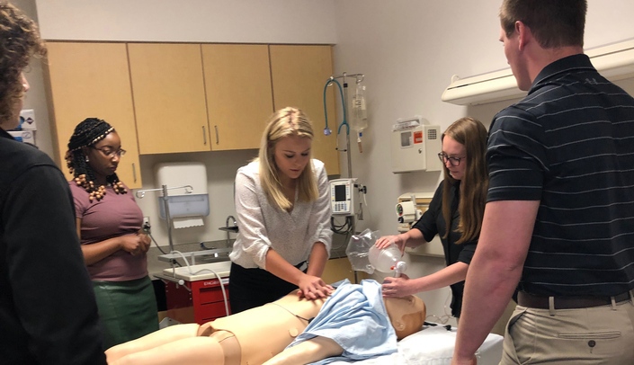 Students react to a simulated cardiac arrest during a tour of the University of Nebraska Medical Center, from left, Tobi Lawani, Emily Hand, Madison Coulter and Jarred Glinn. Hand and Coulter are Chadron State College students.