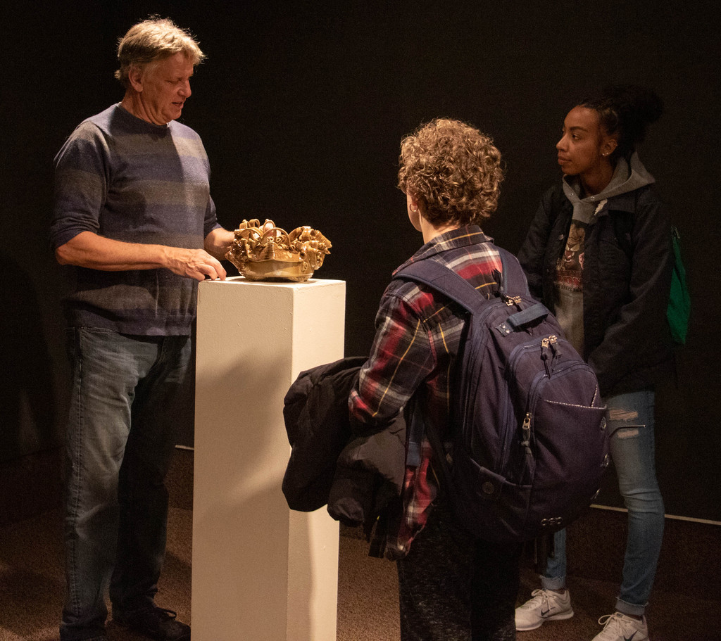 Omaha area potter Wes Galusha describes his work to Chadron State College students