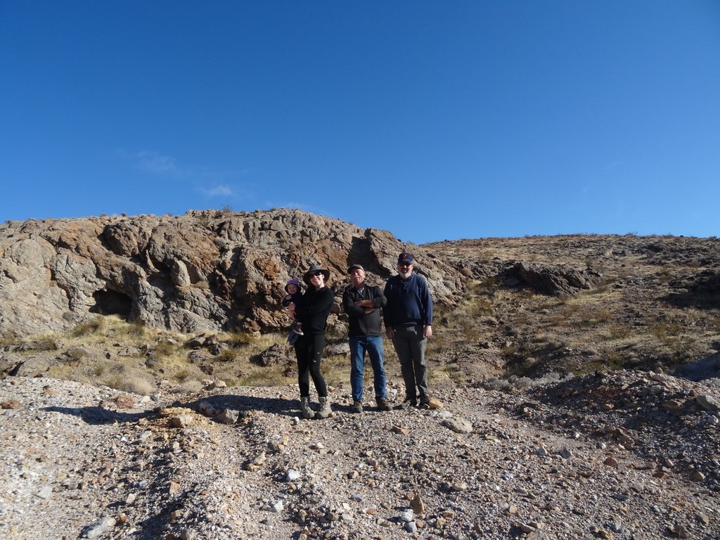 CSC senior geoscience student Brittany Lovett holding her son Bobby, poses with NASA astrobiologist Dr. Michael Tuite and NASA Jet Propulsion Laboratory scientist Greg Peters