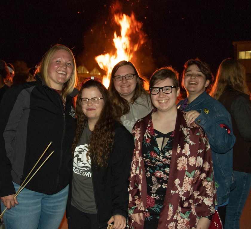 Chadron State College students pose at the Homecoming bonfire south of High Rise