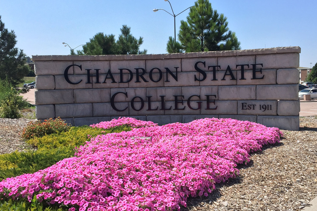 CSC Entrance sign with fresh pink flowers blooming.