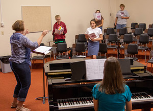 Lauren Stephens leads a vocal music class